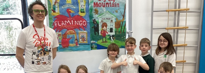 Alex Milway and a class at Exwick Heights pose for a photo